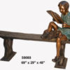 Bronze boy reading on a bench