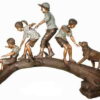 Bronze kids on a log statue