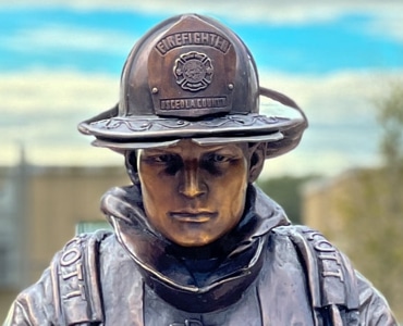 Bronze Life-Sized Kneeling Firefighter Statue