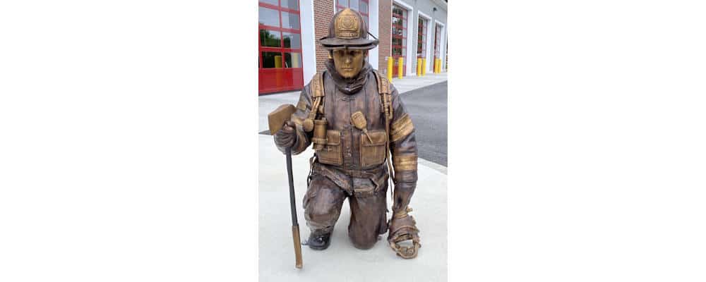 Life-size bronze firefighter memorial statue created for the Dudley Fire Department in Dudley, Massachusetts