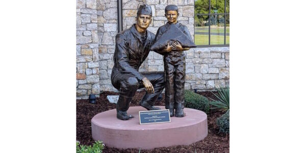 Completed Dan Rooney & Jacob Green bronze tribute installed at Folds of Honor Headquarters in Owasso, Oklahoma, honoring the organization's mission to support military and first responder families.
