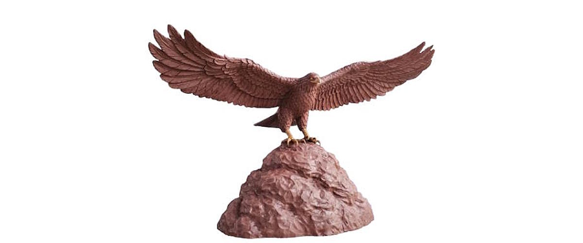 Completed clay sculpture of a peregrine falcon, featuring detailed feather textures, a sharp hooked beak, and a lifelike pose before mold making and bronze casting.