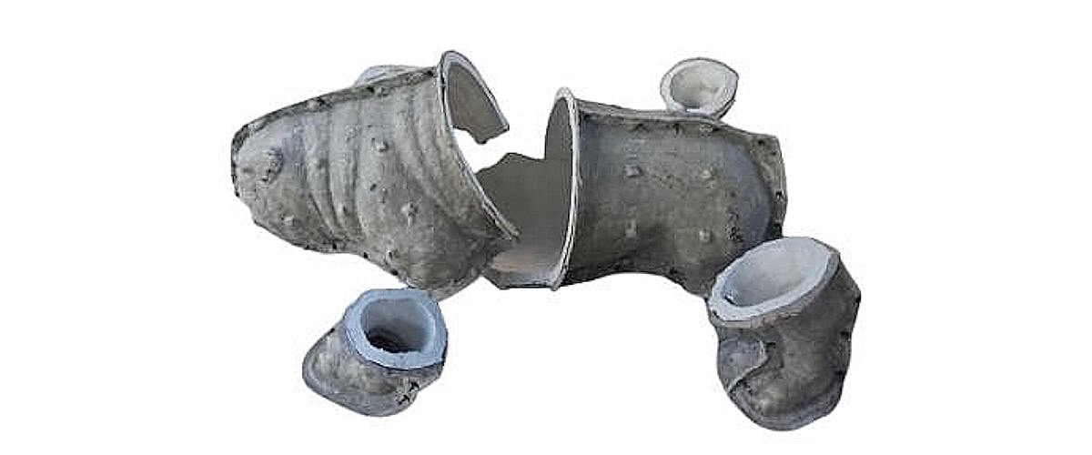 Bulldog clay sculpture divided into sections for the mold-making process