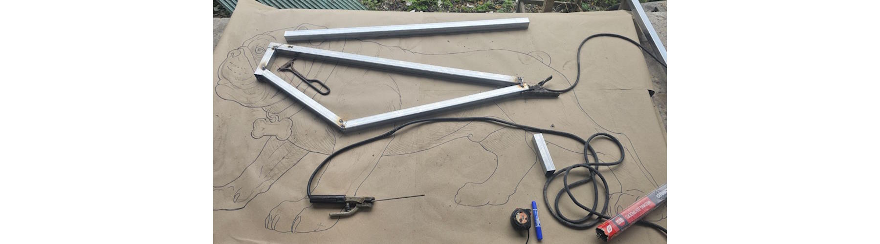 Steel tubing positioned for welding the Tracy High School bulldog sculpture armature